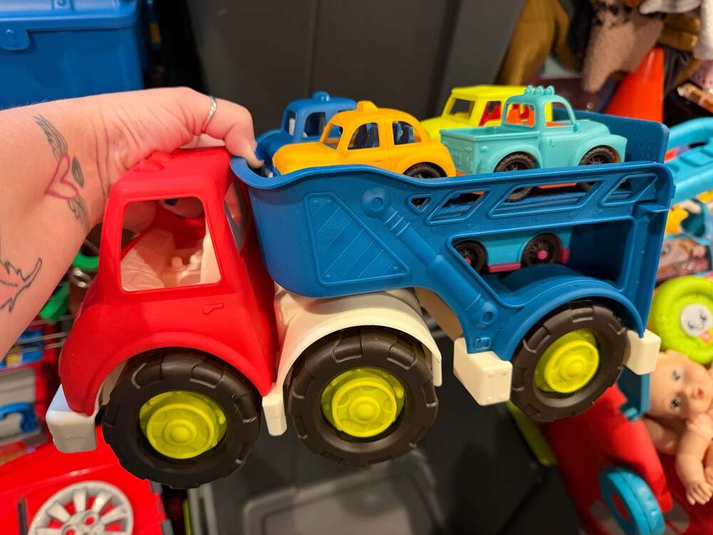 B. toys Happy Cruisers Car Carrier Truck with 5 Mini Vehicles